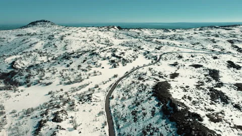 Car in the middle of snowy road, view from above, snow-covered road Stock Footage 237160127