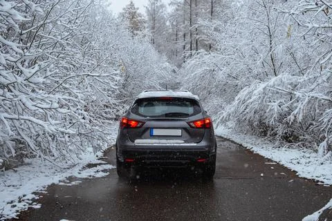 A car in the middle of a winter forest Stock Photos