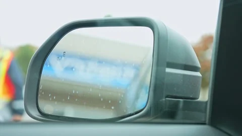 Car mirror adjustment. Driver adjusts side automotive mirror. Electronic au.. Stock Footage 293844795