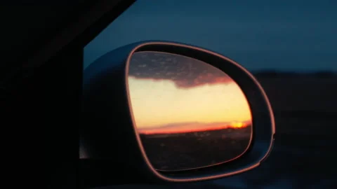 Car mirror in beautiful sunset Stock Footage 219830358