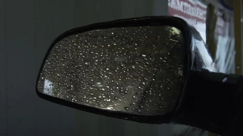 Car Mirror Drive Through Car Wash Droplets Of Water Fall Down Video stock 87880987