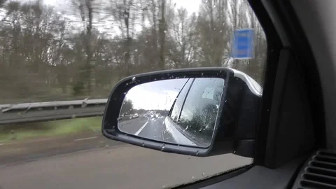 Car Mirror on M4 in Rain Stock Footage 91698529