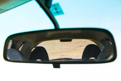 Car mirror reflection close-up, daylight Foto stock