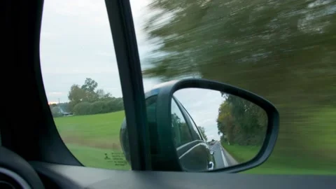 Car Mirror through the fields of Normandy France Stock Footage 156528218