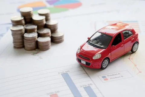 Car model and Financial statement with coins. (finance and car loan concept) Stock Photos