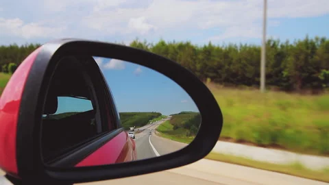 Car in motion in the side mirror of the car view of the highway Stock Footage 152904002