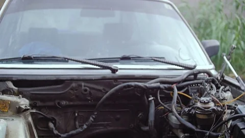 A car with a motor removed from it. Stock Footage 78700097