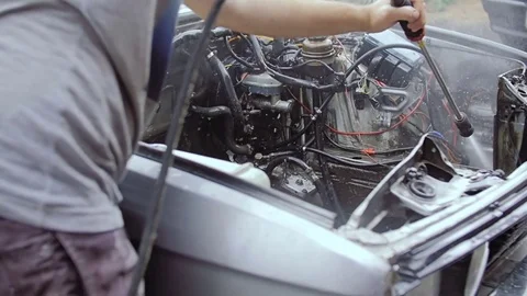 A car with a motor removed from it. Video stock 78852484