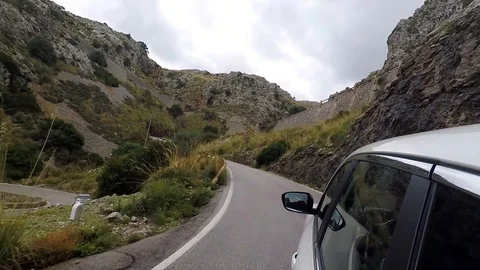 Car mountain drive - POV view from the the car through a winding mountain road Stock Footage 102315135