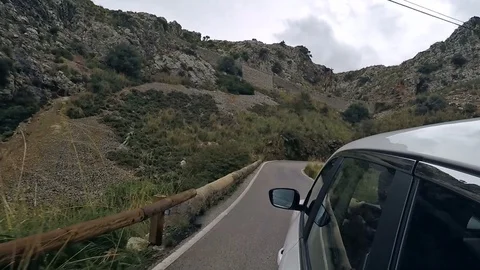 Car mountain drive - POV view from the car through winding mountain road Stock Footage 102315192