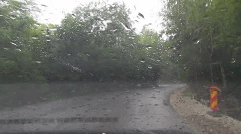 By car on mountain roads in rain Vídeos de archivo 25606294