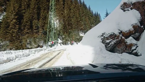 Car on mountain winter road Видео 87228322