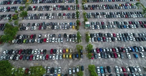 Car movement inside open car parking lot aerial view, Malaysia Stock Footage 85395038