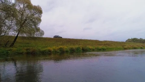 The car moves across the field. Stock Footage 105200834