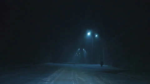The car moves on the road covered with snow in the town. Stock Footage 106947768