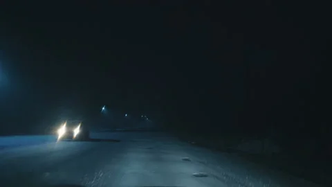 The car moves on the road covered with snow in the town. Stock Footage 106947884