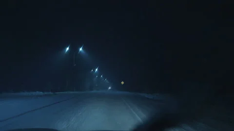 The car moves in winter along a snow covered forest road. Video stock 106948176