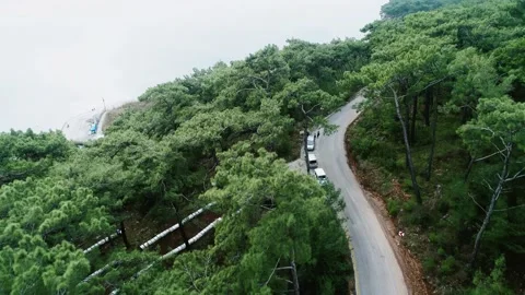 The car is moving from the back view and ocean view Stock Footage 228830057