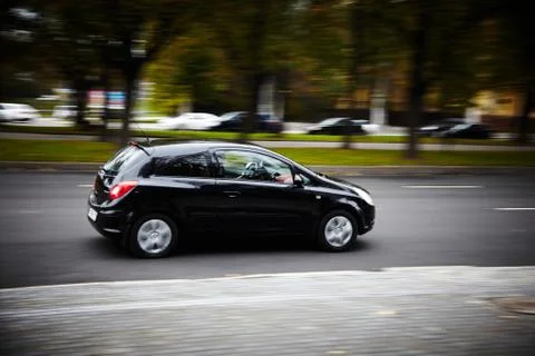 Car moving fast black Stock Photos