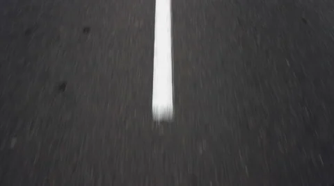 Car moving on the road, passing over broken white marking lines. Stock Footage 55510734