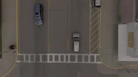 Car Moving Straight Down Main Street Overhead Stock Footage 145235930