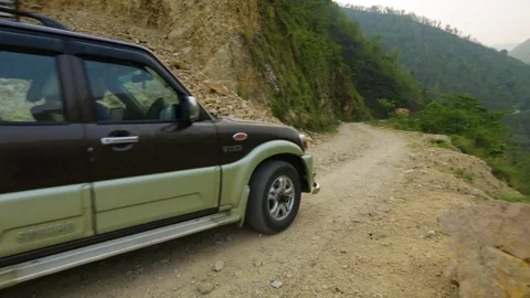 Car moving on an unpaved road Stock Footage 77444543