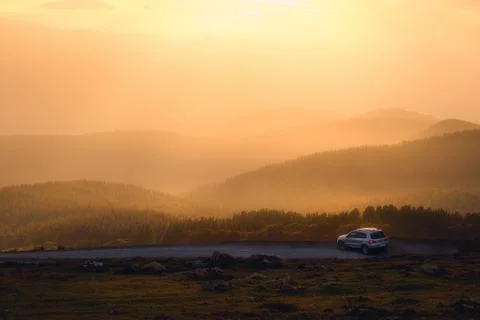 Car in nature at sunset Stock Photos