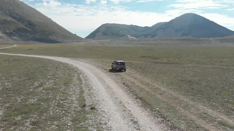 Car in the nature white mountain path Stock Footage 95219906