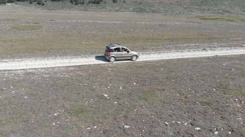 Car in the nature white mountain path Stock Footage 95226658