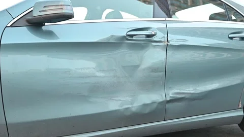 Car with noticeable damage on the driver side door. Clear views highlight 스톡 동영상 336778237