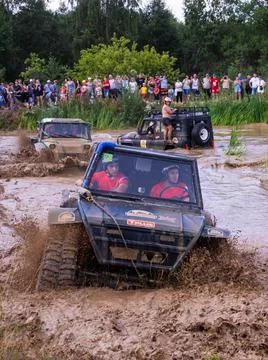 The car overcomes difficult obstacles. Large-scale sports competitions Stock Photos