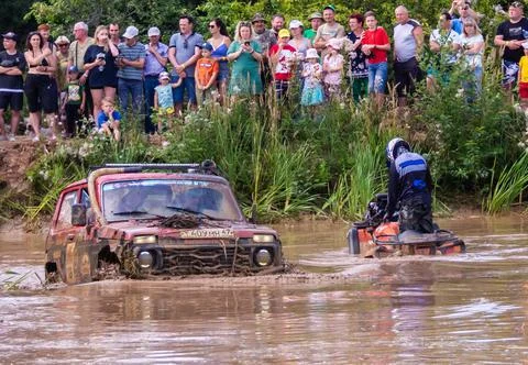 The car overcomes difficult obstacles. Large-scale sports competitions Stock Photos