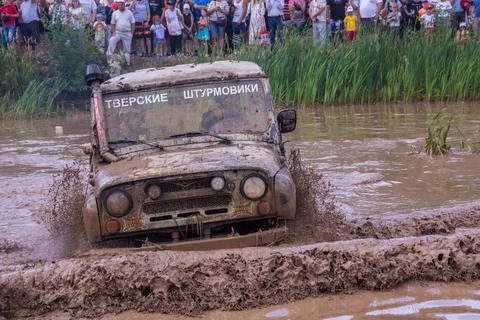 The car overcomes difficult obstacles. Large-scale sports competitions Stock Photos