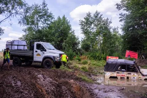 The car overcomes difficult obstacles. Large-scale sports competitions Stock Photos