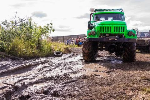 The car overcomes difficult obstacles. Large-scale sports competitions Stock Photos