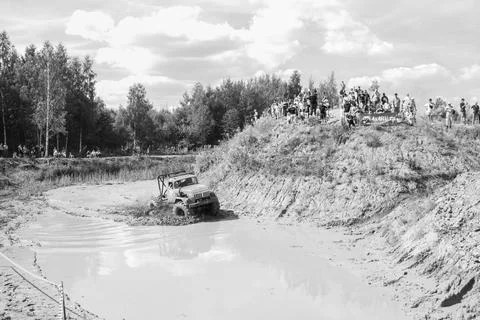 The car overcomes difficult obstacles. Large-scale sports competitions Stock Photos