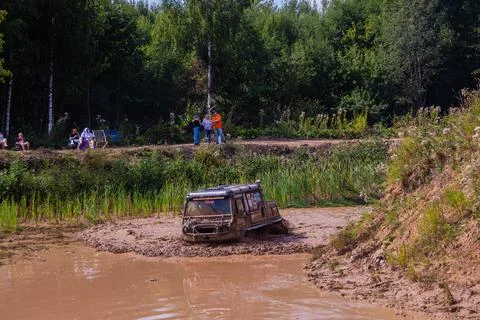 The car overcomes difficult obstacles. Large-scale sports competitions Stock Photos