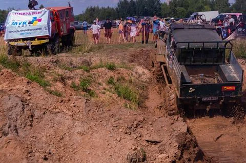 The car overcomes difficult obstacles. Large-scale sports competitions Stock Photos