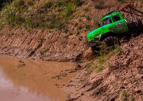 The car overcomes difficult obstacles. Large-scale sports competitions Stock Photos