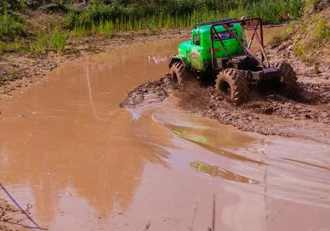 The car overcomes difficult obstacles. Large-scale sports competitions Stock Photos