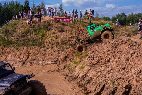 The car overcomes difficult obstacles. Large-scale sports competitions Stock Photos