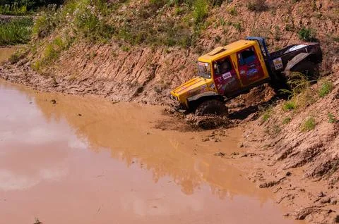 The car overcomes difficult obstacles. Large-scale sports competitions Stock Photos