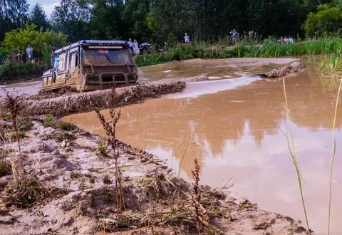 The car overcomes difficult obstacles. Large-scale sports competitions Stock Photos