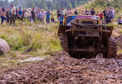 The car overcomes difficult obstacles. Large-scale sports competitions Stock Photos