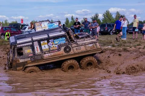 The car overcomes difficult obstacles. Large-scale sports competitions Stock Photos