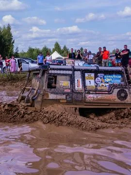 The car overcomes difficult obstacles. Large-scale sports competitions Stock Photos