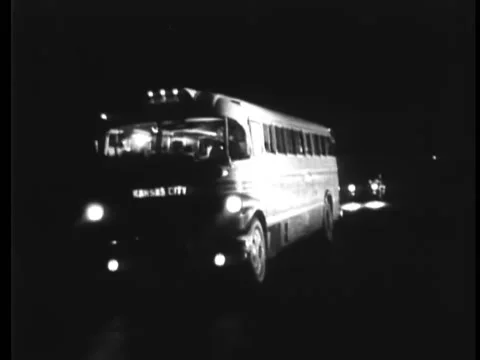 Car overtaking bus headed for Kansas City at night Stock Footage 260256337
