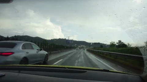 Car overtaking while driving fast on the highway Stock Footage 256605447