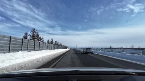 Car overtaking on winter highway with barrier in Hokkaido Video stock 333229908