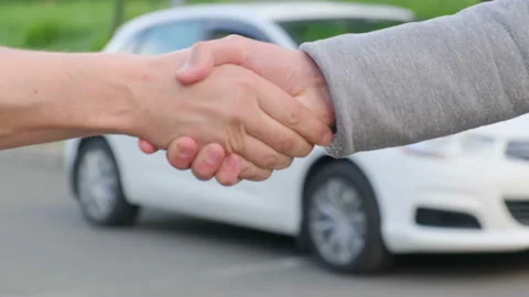 Car owner hands over the keys to the new owner in exchange for money Stock-Footage 155383583
